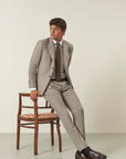 Beige pinstriped suit with peak lapels, custom fit, flannel wool