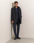 Blue waterproof technical coat with detachable bib