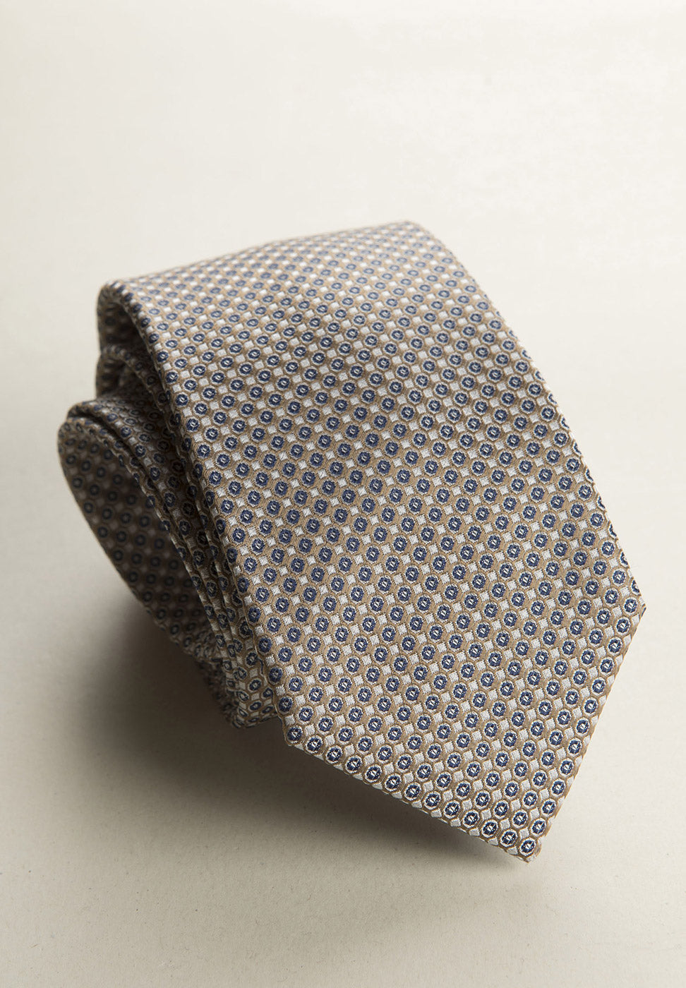 Beige Tie With A White And Blue Micro-Pattern In Silk