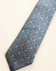 Dark blue silk tie with grey and blue flowers