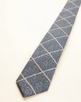 Light blue melange wool tie with checks