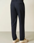Blue trousers with half-elastic pleats