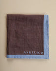 Dark brown clutch bag with light blue linen edge