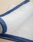 White clutch bag with blue linen edge