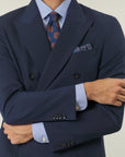 Blue double-breasted suit with peak lapels and custom-fit stretch fabric