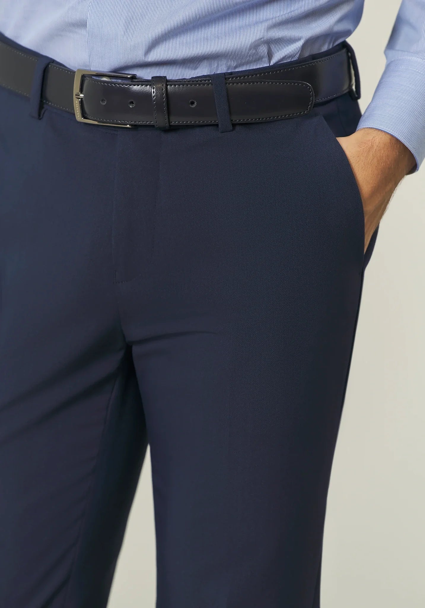 Blue double-breasted suit with peak lapels and custom-fit stretch fabric