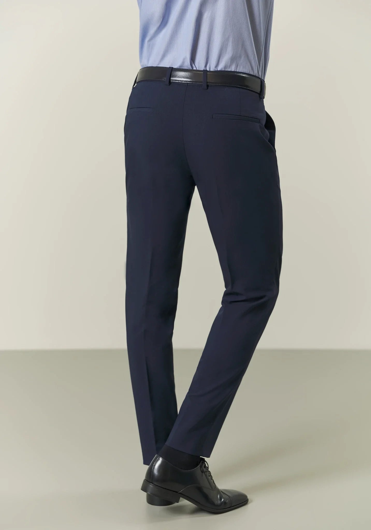 Blue double-breasted suit with peak lapels and custom-fit stretch fabric
