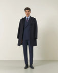 Blue double-breasted suit with peak lapels and custom-fit stretch fabric
