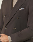 Brown double-breasted suit with peak lapels and slim fit stretch fabric