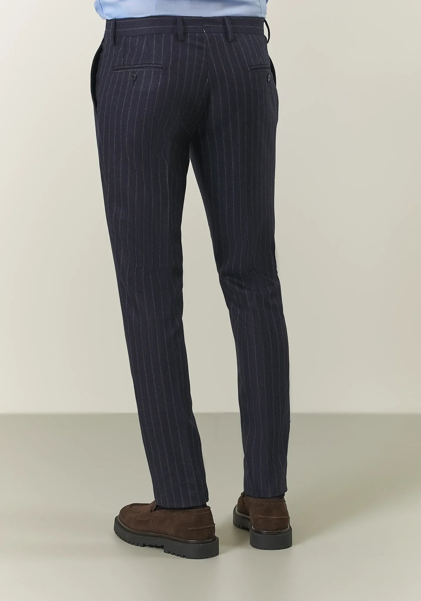 Blue pinstriped suit with peak lapels in custom-fit virgin wool flannel