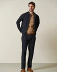 Blue trousers with half-elastic pleats