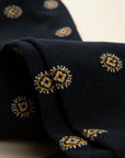Dark blue sock with yellow medal design, stretch cotton