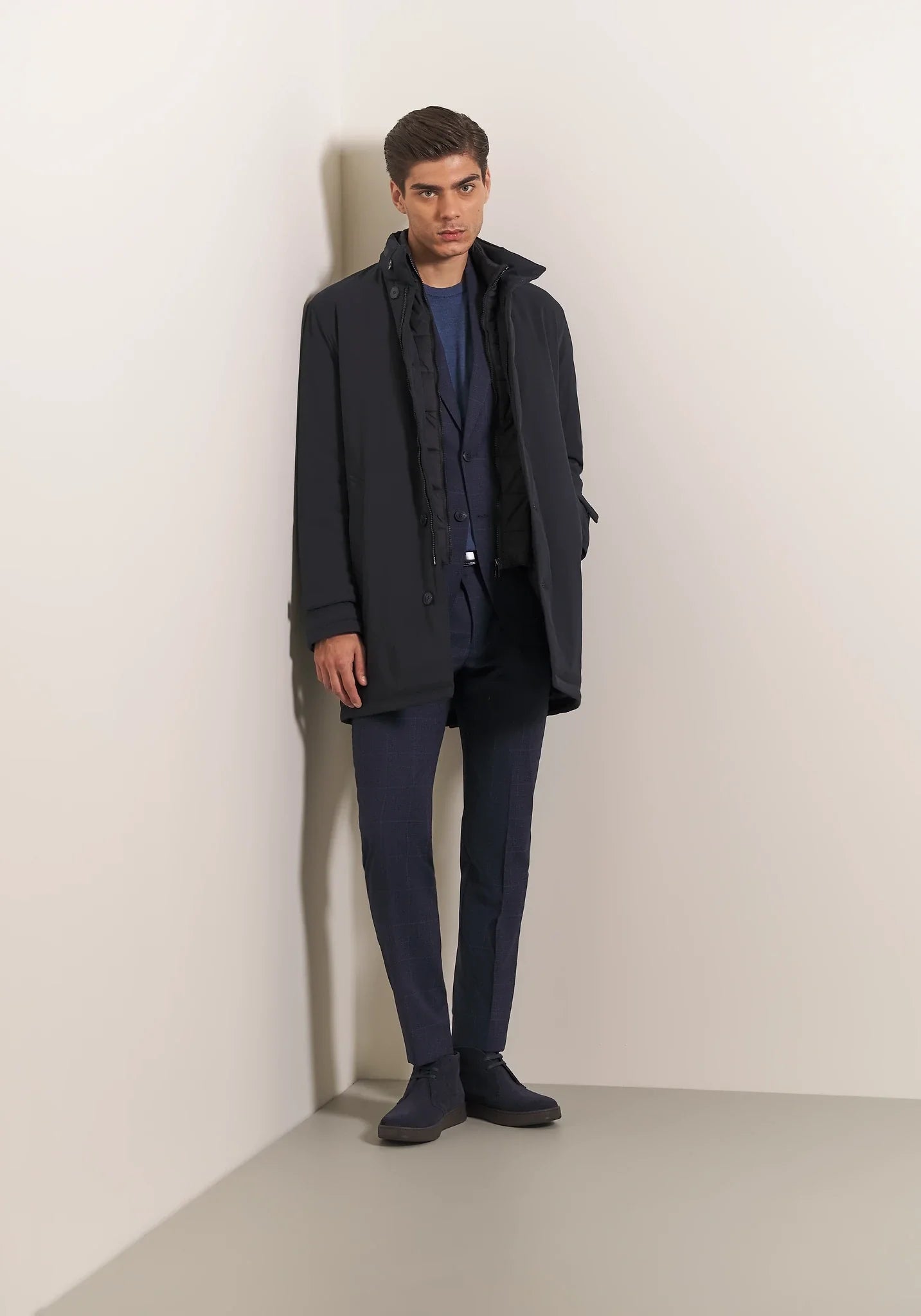 Blue waterproof technical coat with detachable bib