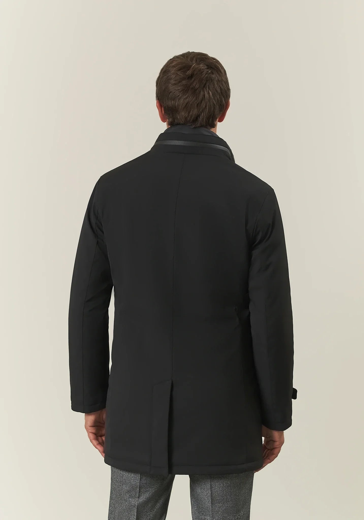 Black waterproof technical coat with detachable bib