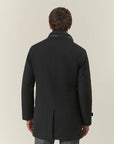 Black waterproof technical coat with detachable bib