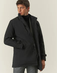 Black waterproof technical coat with detachable bib