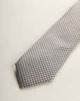 Beige Tie With A White And Blue Micro-Pattern In Silk