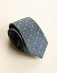 Dark blue silk tie with grey and blue flowers