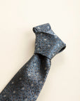 Dark blue silk tie with grey and blue flowers