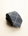 Light blue melange wool tie with checks