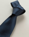 Blue tie with a white and light blue micro-pattern, silk