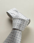 Cream tie with light blue flowers design