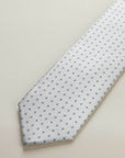 Cream tie with light blue flowers design
