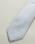 Light grey silk tie with light blue pattern