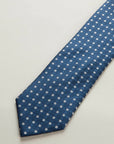 Blue silk tie with check pattern