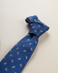 Blue silk tie with dark brown drops pattern