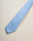 Light blue silk tie with drop pattern