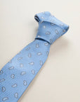 Light blue silk tie with drop pattern