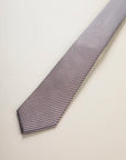 Brown micro-pattern silk tie