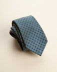 Green tie with blue polka dots, cotton and silk