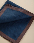 Blue clutch bag with dark brown linen edge